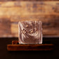 Handcrafted mahogany and teakwood scented men's soap body bar sitting on a wooden stand